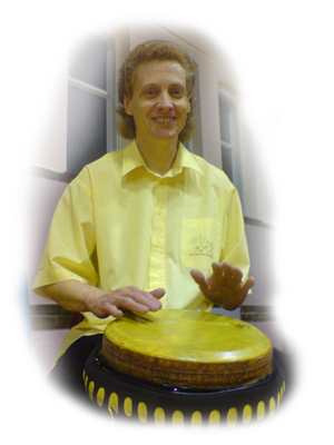 Steve Parker playing his djembe in a youth drumming workshop.